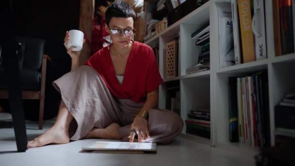 Pensive Brunette Woman Architect Eyeglasses Working Tablet While Sitting Floor — Video Stock