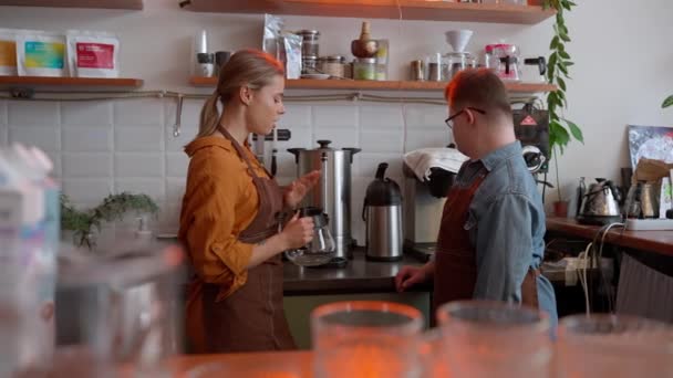 Serious Man Barista Syndrome Studying Coffee Machine His Girl Colleague — Video Stock