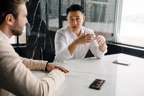 Adult Asian Businessman White Shirt Gesturing Talking His Partner Modern — Stockfoto