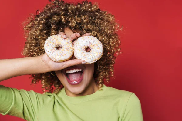 Portrait Young Curly Woman Holding Donuts Her Eyes Red Isolated — Stock Photo, Image