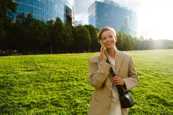 Young Beautiful Smiling Business Woman Talking Phone Looking Aside While — Fotografia de Stock