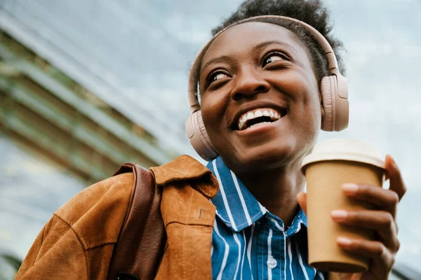 Young African American Woman Listening Music Headphones Drinking Coffee While — Stok fotoğraf