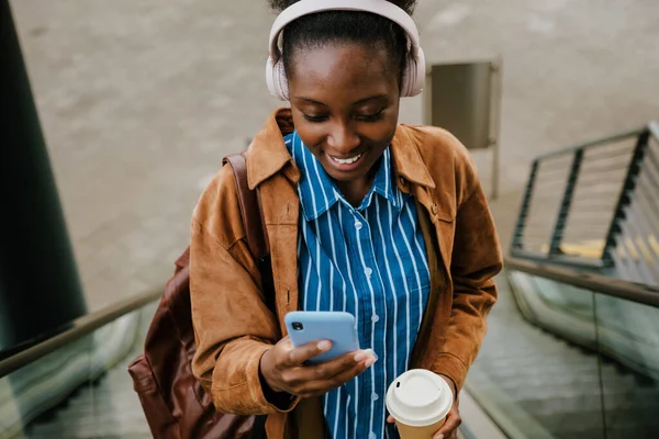 Young Beautiful African Smiling Happy Woman Headphones Coffee Backpack Looking — Stok fotoğraf