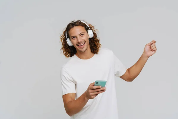 Ginger European Man Headphones Smiling Using Cellphone Isolated White Background — Stock Photo, Image