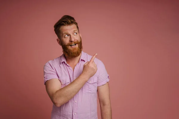 Adult Handsome Stylish Redhead Bearded Smiling Man Pointing Looking Aside — Stockfoto