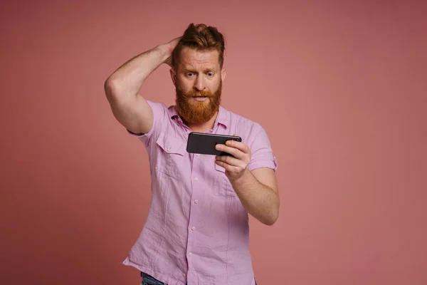 Adult Stylish Redhead Bearded Confused Man Holding His Head Looking — Stockfoto