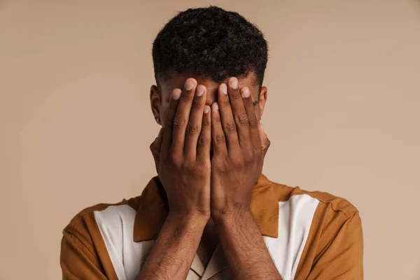 Portrait Young African Man Covering His Face Hands While Standing — Stock Photo, Image