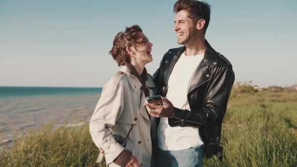 Cheerful Couple Talking Hugging While Standing Field Sea — Stock Video