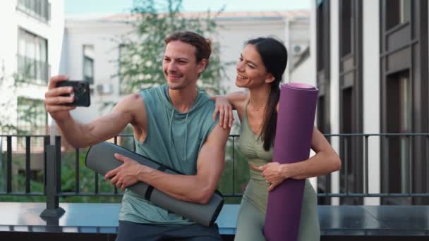 Cheerful Couple Sportsmen Taking Selfies Cell Phone Talking Yoga Practice — Stock video