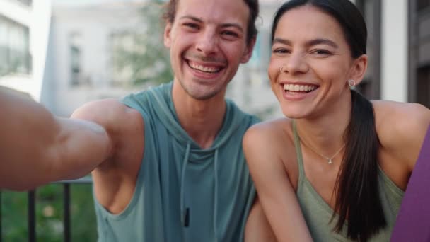 Smiling Couple Sportsmen Filming Video Camera Yoga Practice Hotel Outdoors — Vídeo de Stock