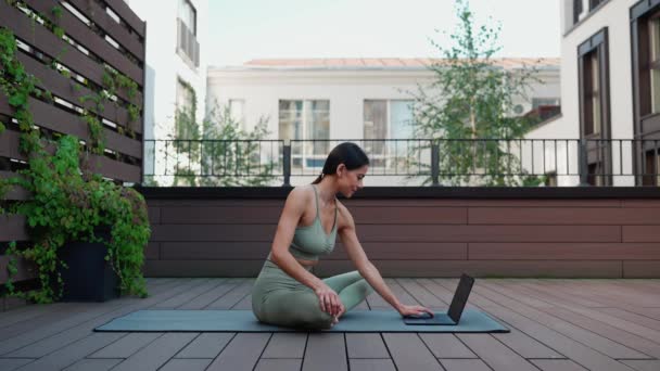 Smiling Brunette Woman Texting Laptop Yoga Practice Hotel Balcony — Stockvideo