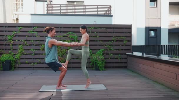 Handsome Couple Athletes Doing Yoga Exercises Hotel Balcony — стоковое видео