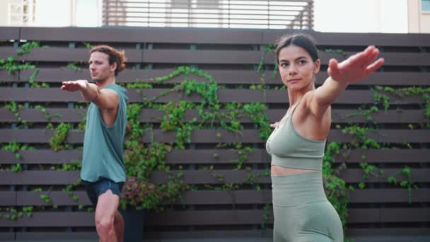 Concentrated Couple Athletes Doing Yoga Exercises Hotel Balcony — Αρχείο Βίντεο