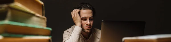 Bored Sad Brunette Businessman Working Laptop Computer Dark Office Surrounded — kuvapankkivalokuva