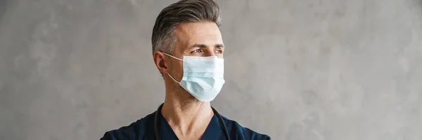 Confident Mid Aged Man Doctor Wearing Medical Protective Mask Looking — Stock Photo, Image