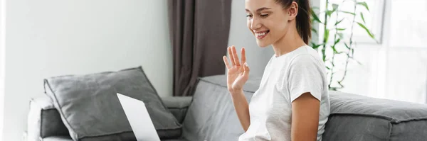 European Smiling Woman Gesturing Sing Laptop While Sitting Couch Home — Stock Photo, Image