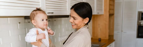 Young Mother Smiling Playing Her Baby Kitchen Home — Stock Photo, Image