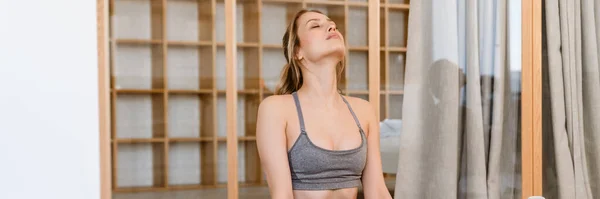 stock image Young white woman doing exercise during yoga practice at home