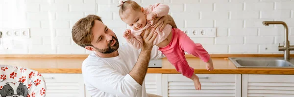 White Father Playing His Daughter While Using Laptop Home — Stock Photo, Image