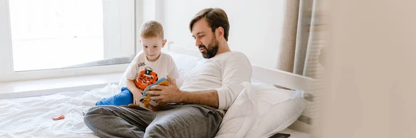 White Father Son Reading Book While Lying Bad Home — Stock Photo, Image