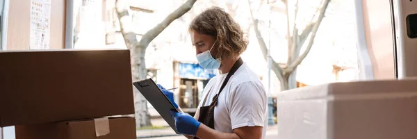 Young White Cafe Worker Face Mask Writing While Taking Delivery — Stock Photo, Image
