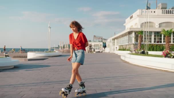 Happy Young Curly Haired Woman Dancing While Rollerblading Sea Outdoors — Stock Video