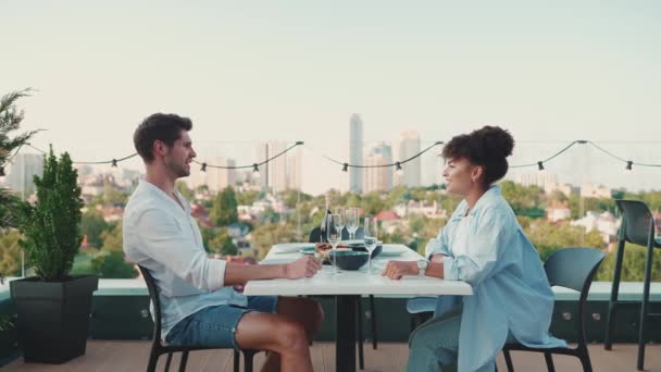 Laughing Multinational Couple Talking Dinner Balcony Restaurant — Stock Video