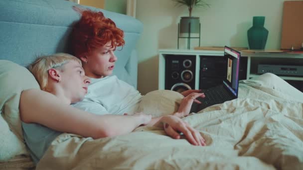 Positive Young Gay Couple Dyed Hair Watching Apartments Rent Online — Stock Video