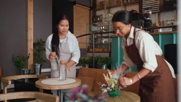 Lovely Multinational Waitresses Talking Cleaning While Preparing Tables Opening Cafe — Stockvideo