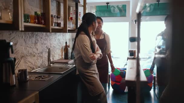 Laughing Multicultural Waitresses Talking Counter Cafe — Stockvideo