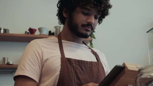 Happy Curly Haired Indian Male Barista Working Cash Register Cafe — Video Stock