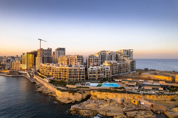 stock image Aerial view of Sliema in Malta, skyline at sunset, blue sea waters and sky. Aerial drone view.