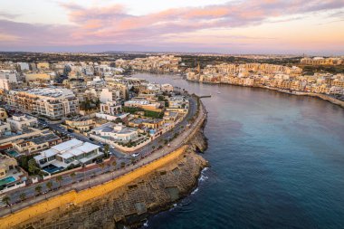 Marsaskala fisherman village in Malta, aerial drone view.