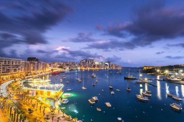 Night panoramic cityscape of Sliema Bay in Malta.