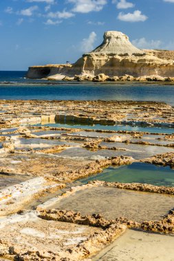 Salt pans in Xwejni Bay beach on the island of Gozo, Malta. Traditional crafts