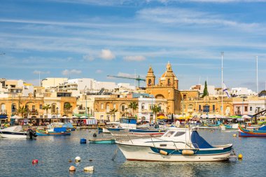 Colorful boats in Marsaxlokk fisherman village in Malta.
