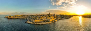 Valletta, Malta aerial panoramic view of old town at sunset.