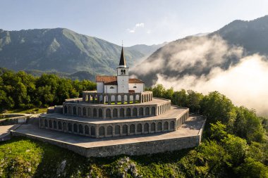 Drone view of St Anton Church and Kobarid Ossuary in Slovenia. Caporetto Memorial from First World War. clipart