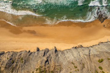 Aerial droe view of beautiful natural Cordoama beach in Portugal Atlantic coast clipart