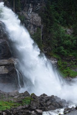 The Beauty of Krimml Waterfall in Austria's Summer Sun clipart