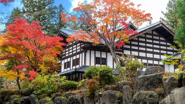 The traditional Japanese room open to view of beautiful colorful view