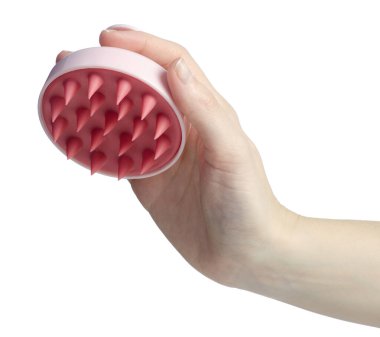 Beyaz arka plan izolasyonunda pembe kafa derisi masajı fırçası.