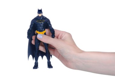 Oyuncak Batman 'in elinde beyaz arka plan izolasyonu