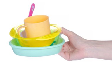 Bebek plastiği ve bardak, beyaz arka plan izolasyonunda kaşık.