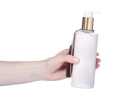 Elinde şeker kutusu olan krema şişesi beyaz arka plan izolasyonu