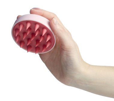 Beyaz arka plan izolasyonunda pembe kafa derisi masajı fırçası.