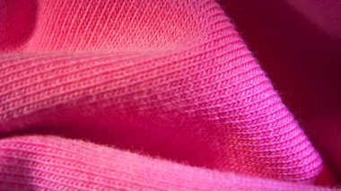 Pembe pamuk tekstil kumaş kumaş dokusu bulanık arkaplan makrosu