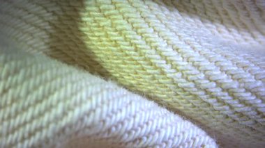 Bej beyaz pamuklu kumaş kumaş kumaş dokusu bulanık arka plan makrosu