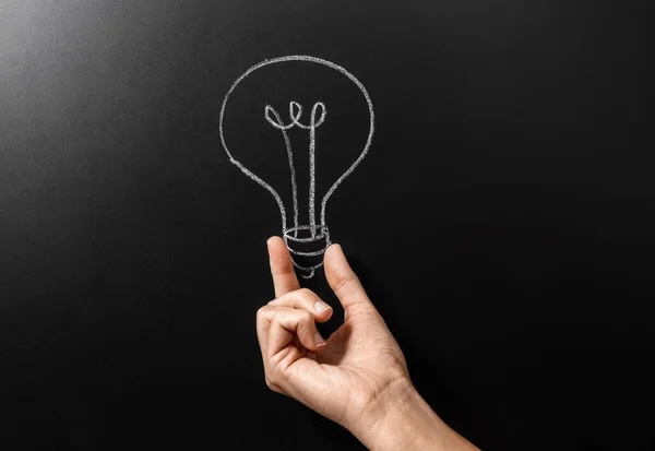 Electricity Energy Power Consumption Concept Close Hand Holding Lightbulb Drawing — Fotografia de Stock
