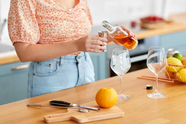 Drinks People Concept Close Woman Pouring Liquor Glass Bottle Jigger Rechtenvrije Stockfoto's